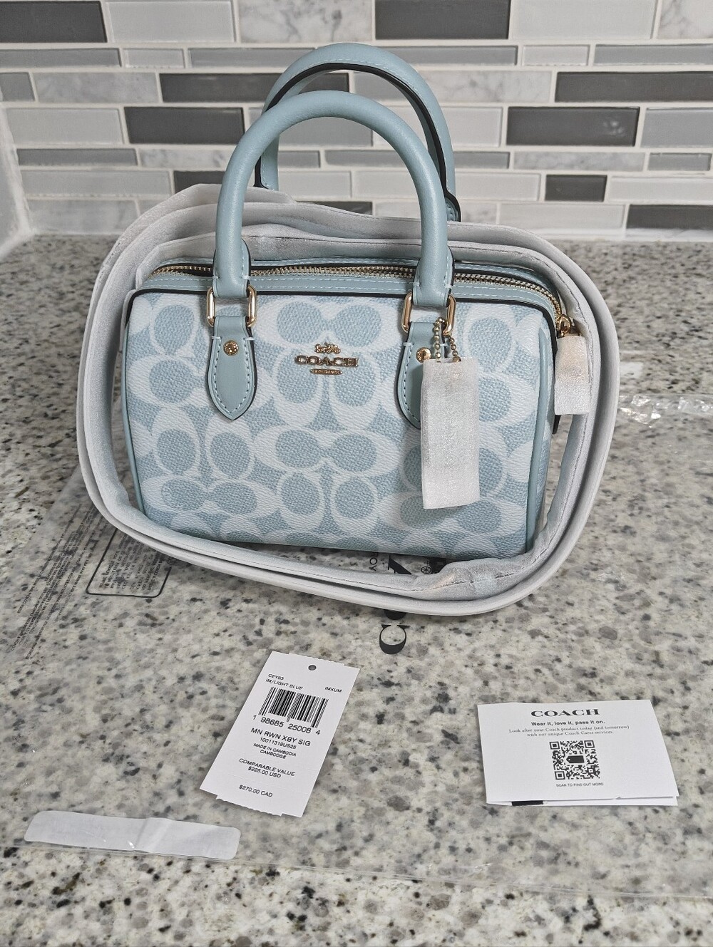 Coach Mini Rowan Crossbody BagIn Signature Canvas (Light blue)
